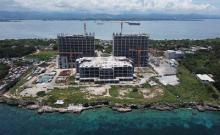 Billionaire Dennis Uy’s PH Resorts Group Holdings Inc. says a sale of the unfinished Emerald Bay Resort in Cebu, Philippines has not collapsed, but will close as planned this month.